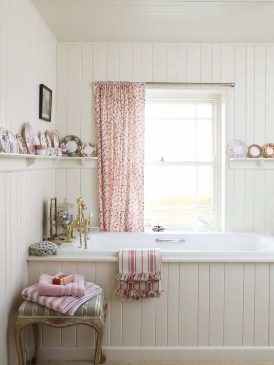 freestanding tub in small bathroom with