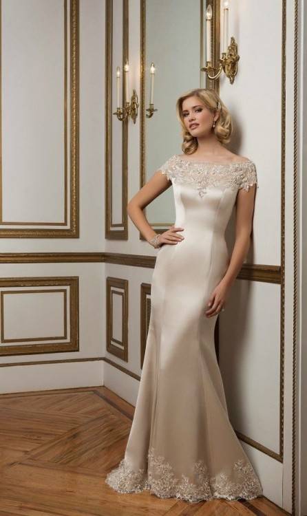 A classic, lace gown with cap sleeves and a gorgeous, mermaid silhouette,  this design is a timeless bridal pick