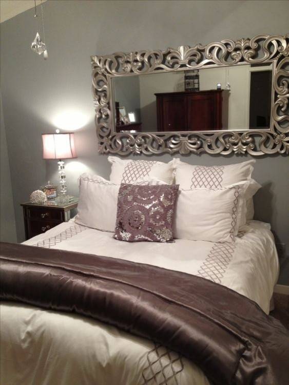 no headboard bed again utilizing decorative pillows in place of a headboard  this brown and orange