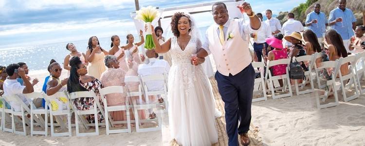 A scoop neck that shows off a bit of cleavage and a simple style that works  for destination weddings, we love the ease of this gown