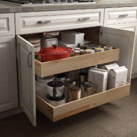 Remodeled kitchen with cabinet drawer for waste and recyclable baskets by Neal's Design Remodel