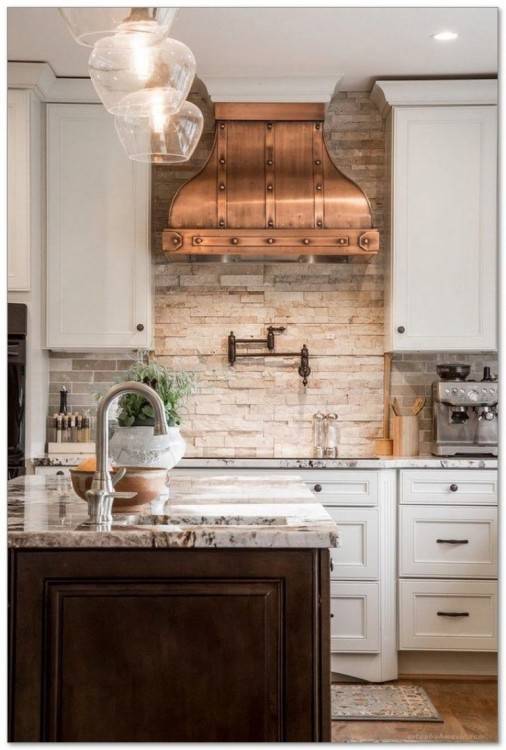 A perfect example of how the right splashback can make a kitchen and steal the show! This neutral Scandi inspired space is given character, a pop of colour