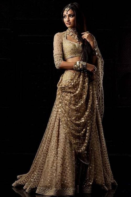 Traditional Indian wedding dresses include an elite collection of bridal dresses, embroided sarees, zari sarees and gem embellished wear that come in