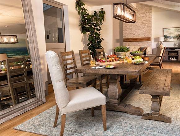 The dining room looks simple with its hardwood flooring and dining set