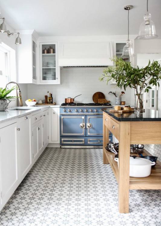 A convenient pull down rack maximizes space usage in an upper kitchen  cabinet at the Peak at Home Showroom, 47 Central Avenue in Kansas City,  Kansas