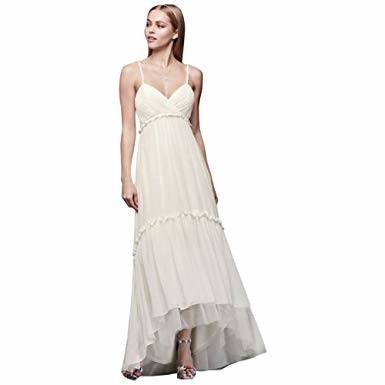 A trumpet wedding dress that is finished with a scallop hem with an  intricate floral designs