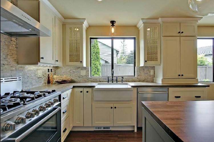 kitchen cabinets with windows behind window behind stove with high hood kitchen cabinets under windows