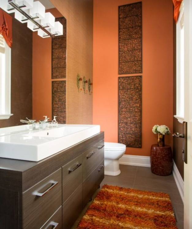 Traditional orange master bathroom with white single sink and wall lighting