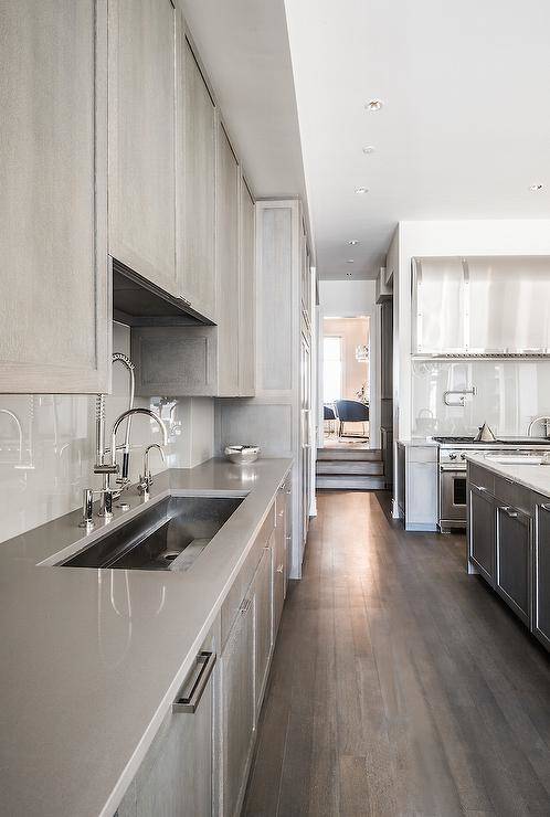 Caesarstone London Grey Quartz countertops in a white and gray kitchen