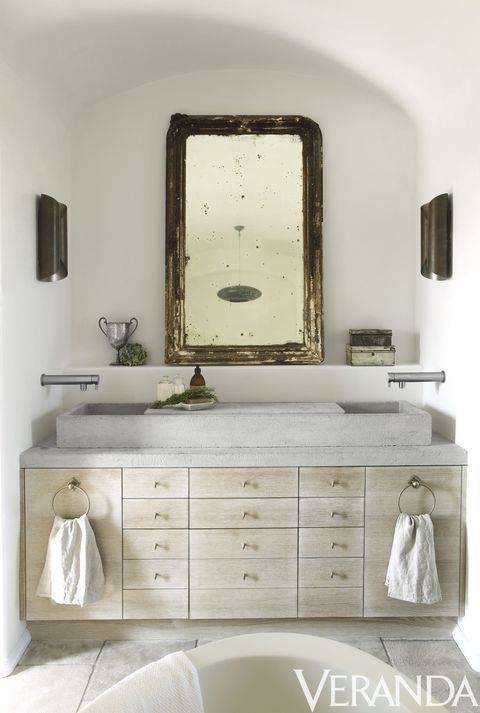 A quaint looking bathtub which is supported by a wooden foundation