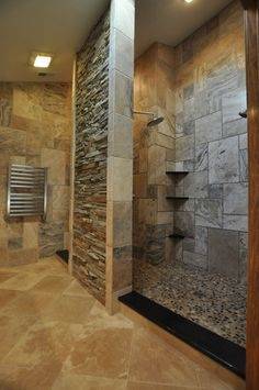 Small bathroom idea with coral stone veneer on the wall [Design: Gary J  Ahern