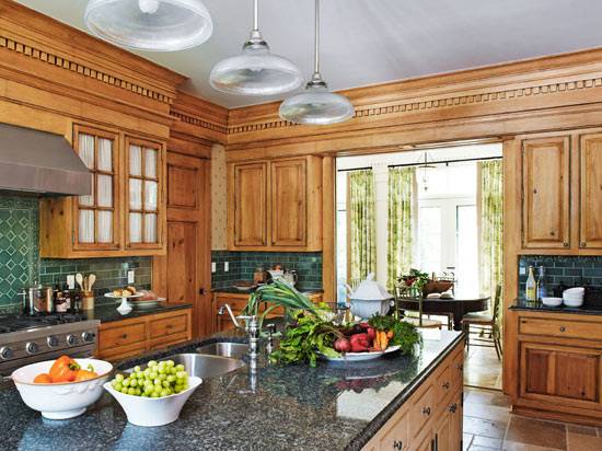 Vaulted ceiling and skylight both provide an airy atmosphere to this sophisticated kitchen