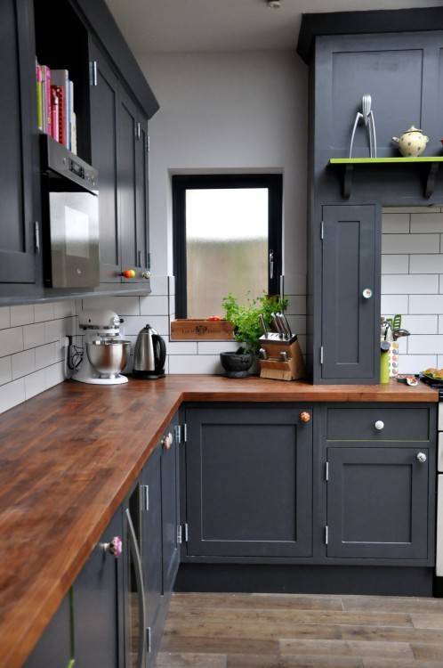 Crown molding around cabinets is painted white to match the ceiling, not  natural wood to match the cabinets as is common