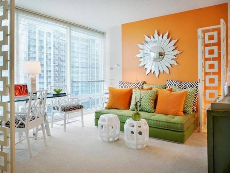 Lovely blend of blue and orange in this vibrant dining room [Design:  Adeeni Design