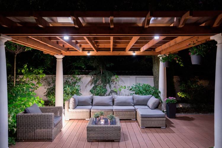 Patio arranged for outdoor dining and entertaining after dark