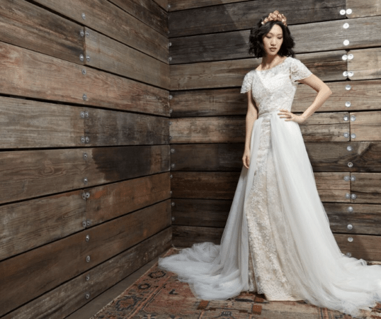 Delicate composition of wedding dresses and accessories decorated in rustic style