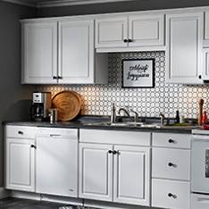 Knotty alder kitchen cabinets in natural finish by Kitchen Craft Cabinetry