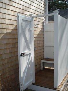 This beach house went with a surf theme for their outdoor shower