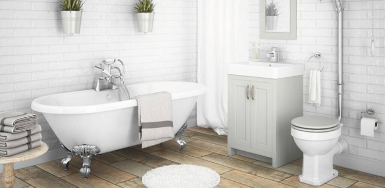 Retro flooring, metro tiles and a high level cistern give this bathroom a beautiful traditional look