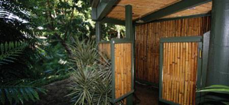 There aren't any showers, but if you're driving back north, you can always pop into Waianapapana State Park and hit their outdoor shower