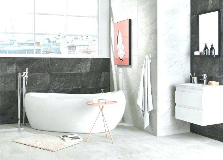 bath with grey panels in light grey room