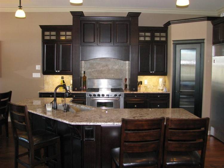 Warm Maple wood cabinets with a white kitchen island