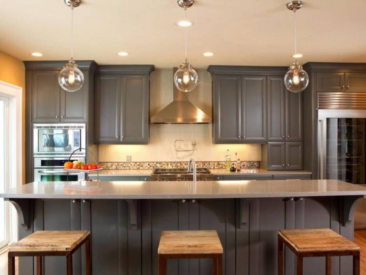 Like two colors of cabinets, copper backsplash and exposed brick