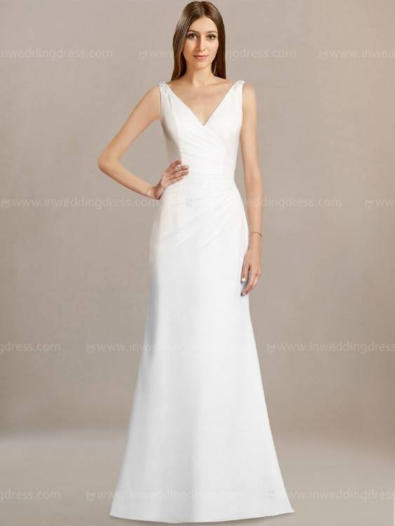 This long sleeve modest bridal gown features a bold lace pattern and a darling sleeve